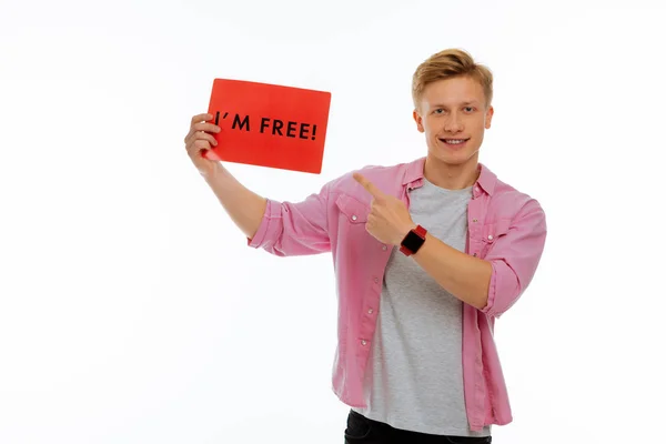 Nice cheerful young man feeling absolutely free — Stock Photo, Image