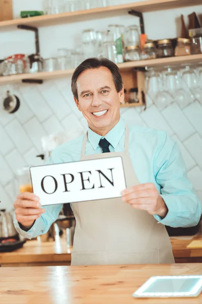 Cheerful owner opening his coffee shop — Stock Photo, Image