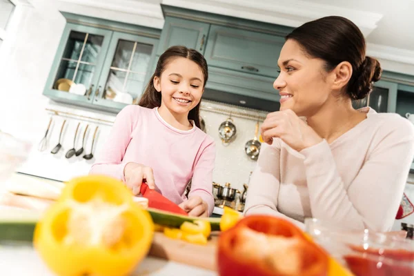 Beautiful female person looking at her kid with love — Stock Photo, Image