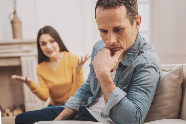 Mature man wearing denim shirt feeling thoughtful — Stock Photo, Image