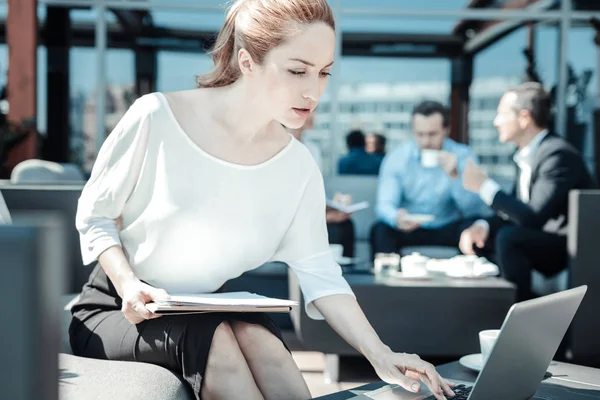 Attentive female person looking at screen of computer — Stock Photo, Image