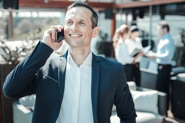 Happy businessman having positive talk — Stock Photo, Image