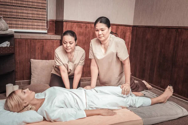 Pleasant Asian women working as masseuses in the salon — Stock Photo, Image