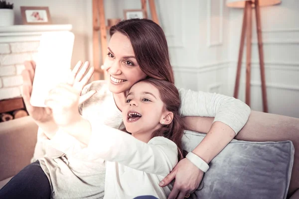 Positive delighted girl looking into the camera — Stock Photo, Image