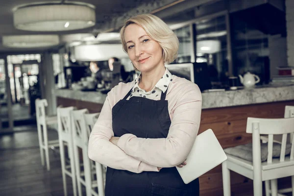 Successful entrepreneur standing in her own restaurant — Stock Photo, Image