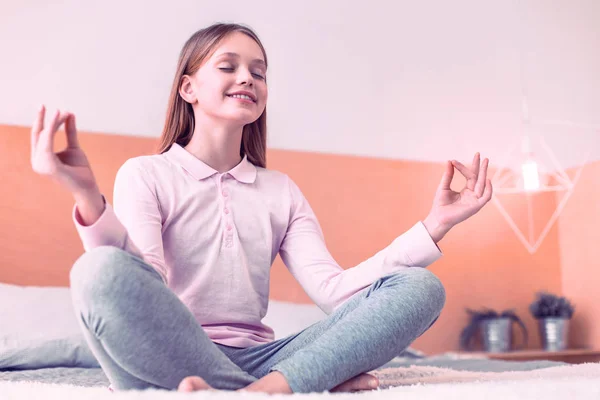 Pretty girl sitting in a lotus position — 图库照片