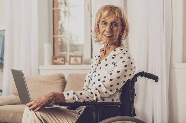 Attentive female person staring at camera