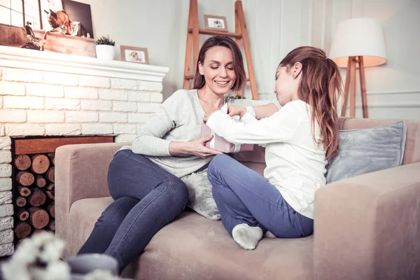 Nice cute girl opening a gift box — Stock Photo, Image