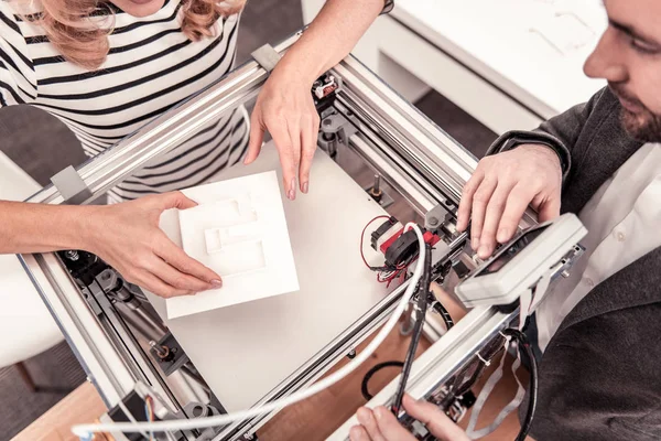 Top view of white detail laying on 3D printer — 스톡 사진