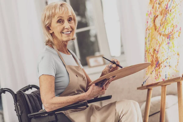 Positive delighted mature woman looking at camera — Stock Photo, Image