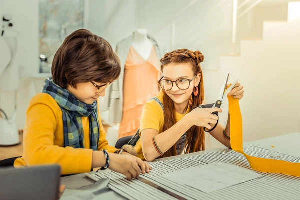 Girl feeling lovely while studying in design school with friend — Stock Fotó