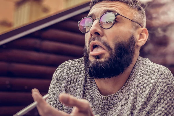 Nice young man not liking the cigarette — Stock Photo, Image