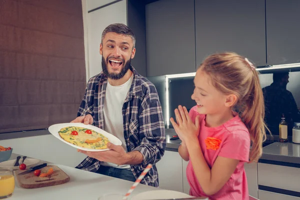 Bearded tall man in a checkered shirt feeling great — Stock Photo, Image