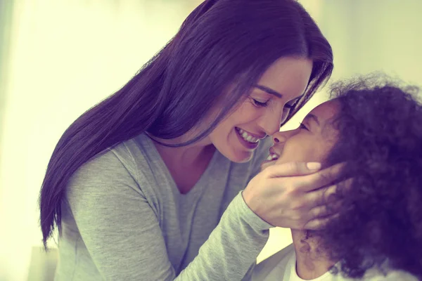 Affectionate mom holding her beloved child close. — Stock Photo, Image