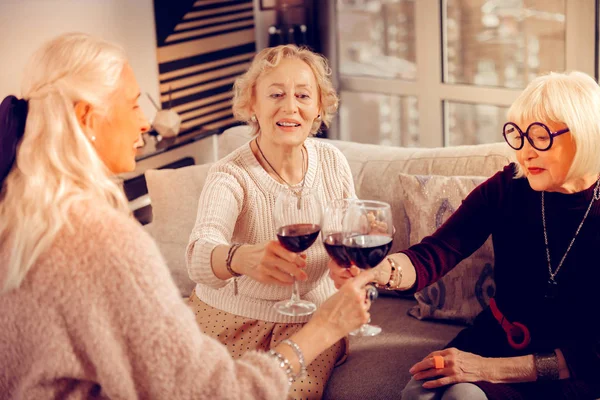 Delighted joyful senior women celebrating their reunion — Stock Photo, Image