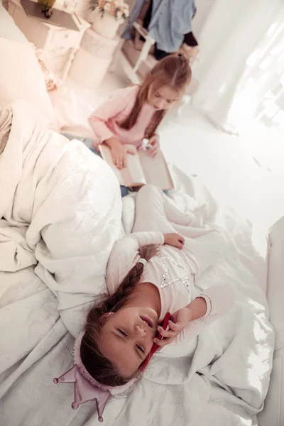 Pleasant sleepy girl answering the phone call — Stock Photo, Image