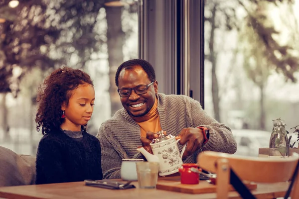Cheerful father feeling happy having breakfast with daughter — Stock Photo, Image
