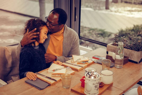 Loving father kissing his cute beautiful curly girl — Stock Photo, Image