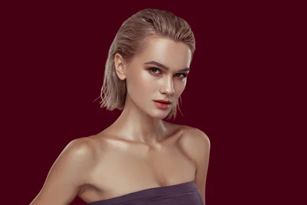 Young model with blonde short hair showing strong face