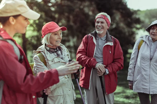 Elderly people feeling inspired by hiking in mountains — Stock Photo, Image