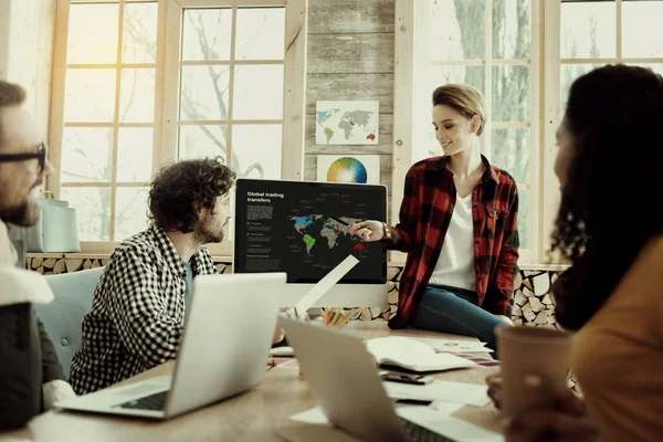 Pleasant-looking designer explaining new concept to partners — Stock Photo, Image