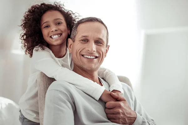 Smiling high-spirited kid and father spending time together — Stock Photo, Image