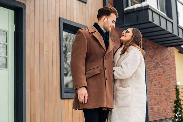 Handsome boyfriend looking at his lovely appealing woman — Stock Photo, Image