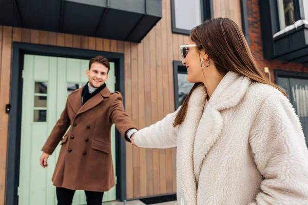 Stylish wife wearing warm beige coat asking her man to go for a walk — Stock Photo, Image