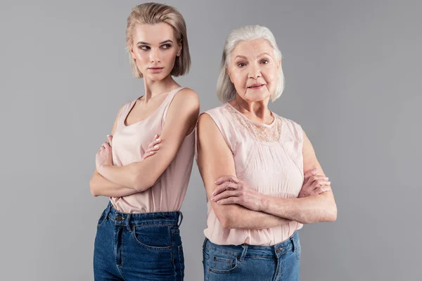 Dangerous blonde young girl connecting her hands — Stock Photo, Image