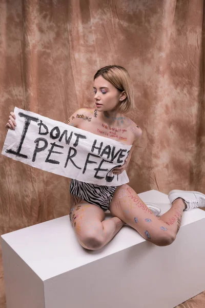 Nice young woman showing how to love yourself — Stock Photo, Image