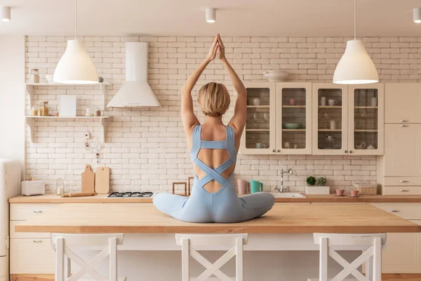 Blonde skinny yoga master showing professional skills — Stock Photo, Image