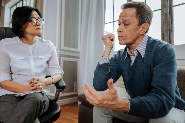 Desperate angry man expressively describing his problems in life — Stock Photo, Image