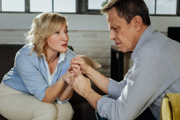 Desperate adult couple having problems and discussing them together — Stock Photo, Image