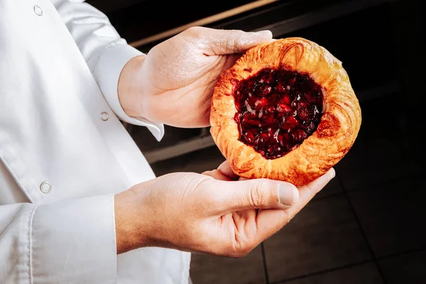 Delicious bun with cherry filling just from the oven — Stock Photo, Image