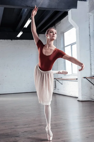 Attractive graceful ballerina dancing on one leg — Stock Photo, Image