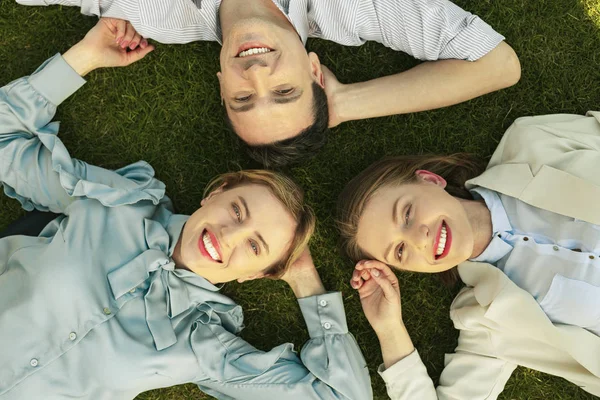 The best friend lying on green grass in park — Stock Photo, Image