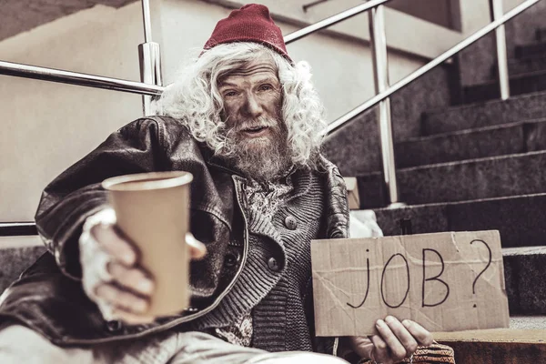 Homeless elderly trying to draw attention to himself. — Stock Photo, Image