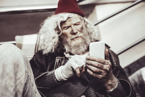 Concentrated Caucasian almsman typing message to his friend. — Stock Photo, Image