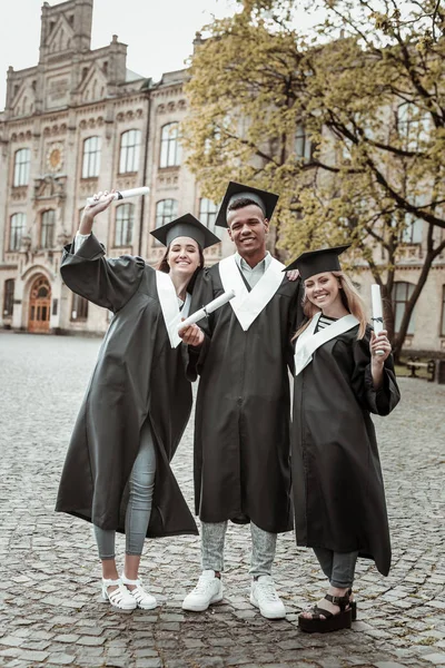 Cheerful international students looking straight at camera — Stock Photo, Image