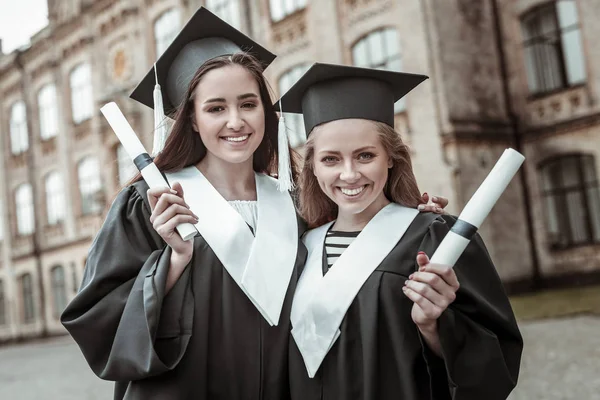 Cheerful two girls looking straight at camera — Stock Photo, Image