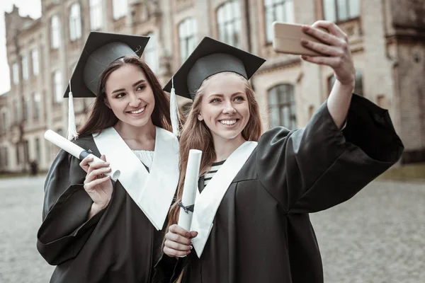 Pleased two females doing selfie photo together — Stock Photo, Image