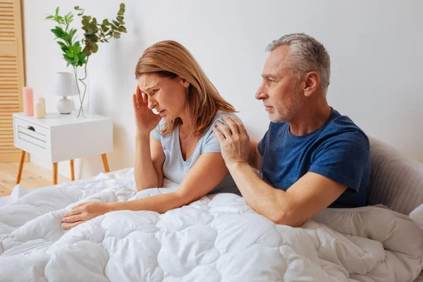 Blonde woman having headache after argument with husband — Stock Photo, Image