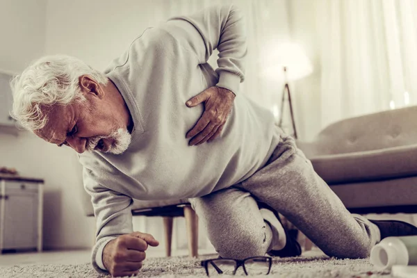 Aging grandfather falling down because of shooting pain in heart — Stock Photo, Image