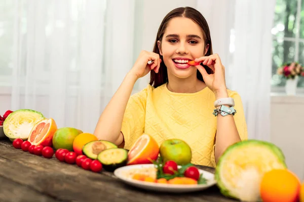 Woman having a fruit diet with various fruit — Stock Photo, Image