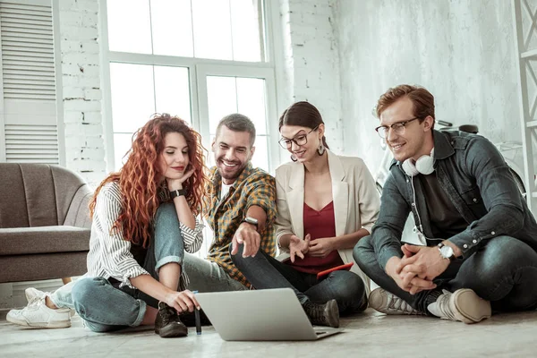 Delighted nice colleagues looking at the laptop screen — Stock Photo, Image