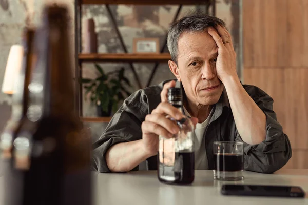 Adult short-haired man having problems with alcohol — Stock Photo, Image