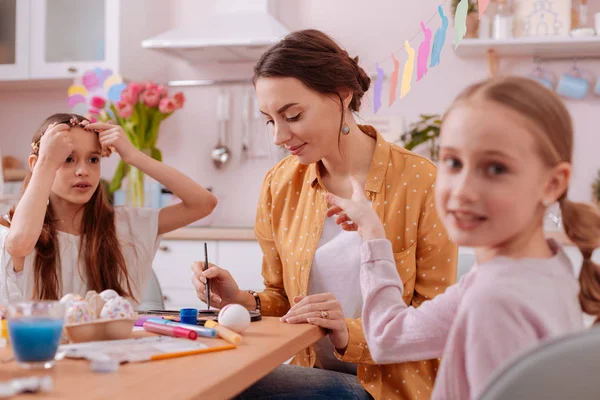 Close up of cute teenager that pointing at mother — Stock Photo, Image