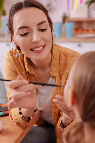 Portrait of charming woman that looking at her kid — Stock Photo, Image