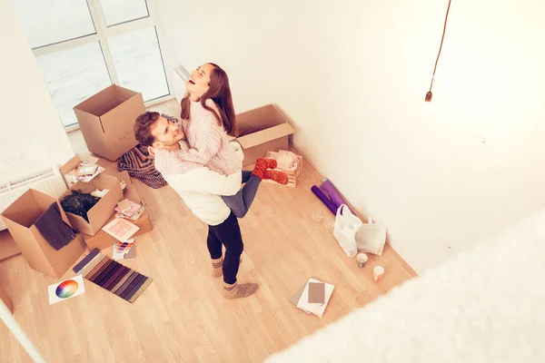 Loving wife jumping while feeling happy and free with her man — Stock Photo, Image