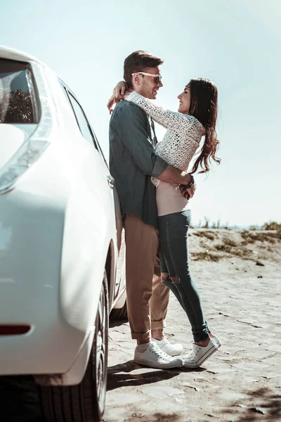 Charming longhaired girl standing close to her boyfriend — Stock Photo, Image